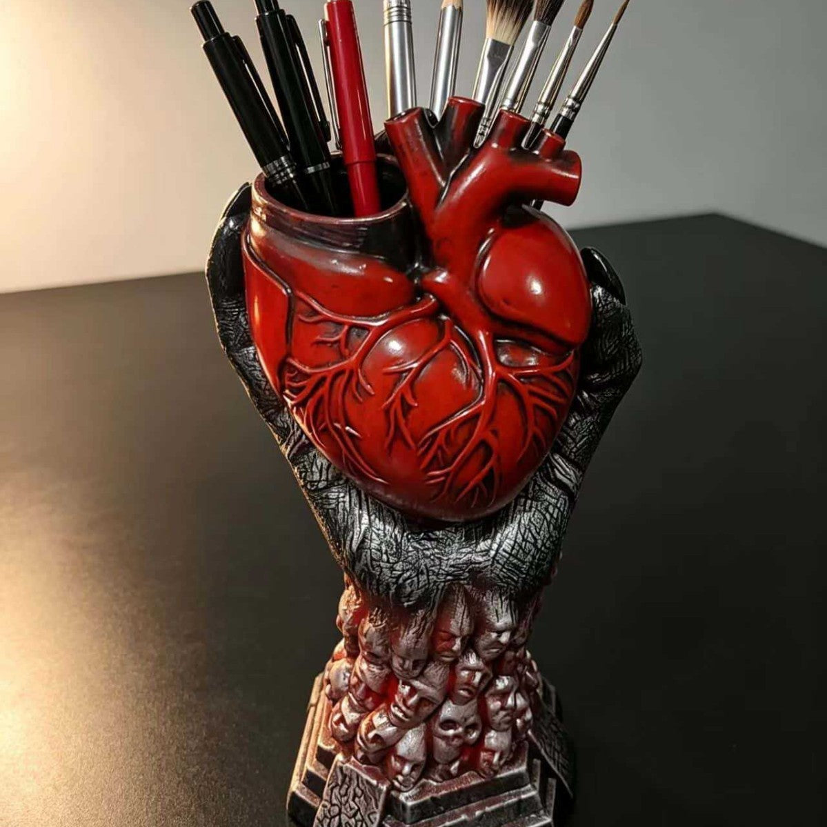 The Heartkeeper Planter, Crimson Heart, styled indoors holding pens and brushes
