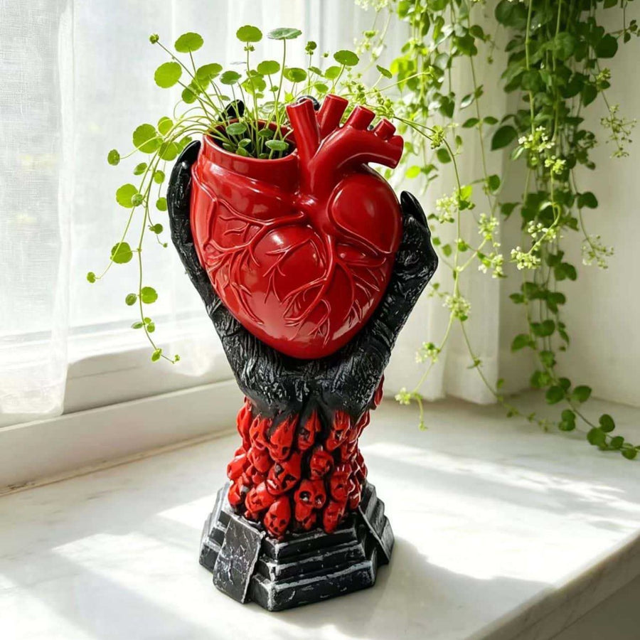 The Heartkeeper Planter, Crimson Heart, planted with greenery on a windowsill