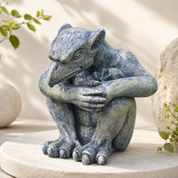 The Brooding Guardian Gargoyle hunched over a small skull