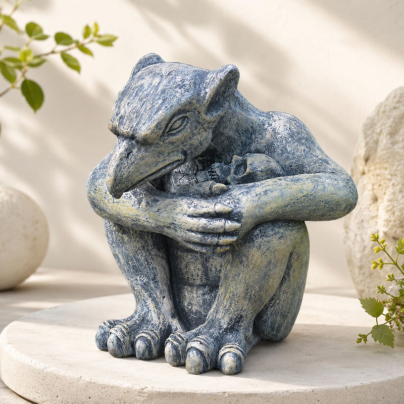 The Brooding Guardian Gargoyle hunched over a small skull
