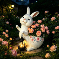 The Lantern Rabbit Planter — a rabbit garden planter holding a lantern, planted with roses