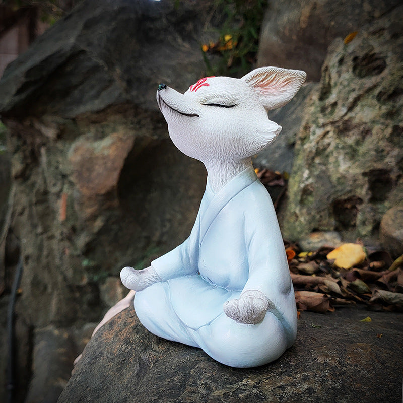 The Little Zen Fox in White, meditating on a stone