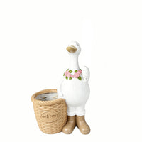 The Welcome Goose Planter — a goose garden planter in boots beside a woven welcome basket